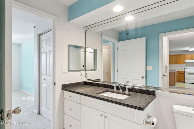 bathroom with vanity and toilet