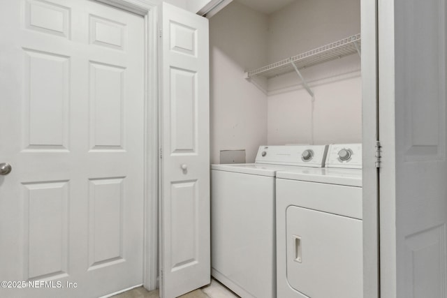 clothes washing area with washer and dryer