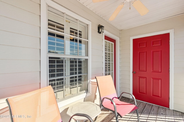 entrance to property featuring ceiling fan