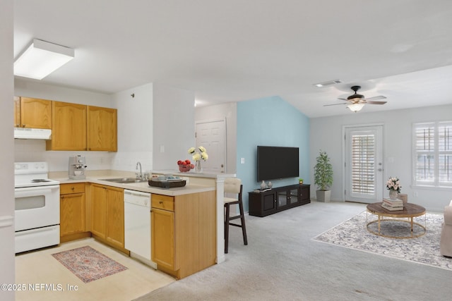 kitchen featuring sink, white appliances, ceiling fan, kitchen peninsula, and light colored carpet