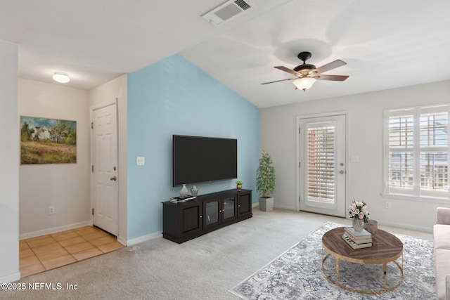 carpeted living room featuring ceiling fan and lofted ceiling