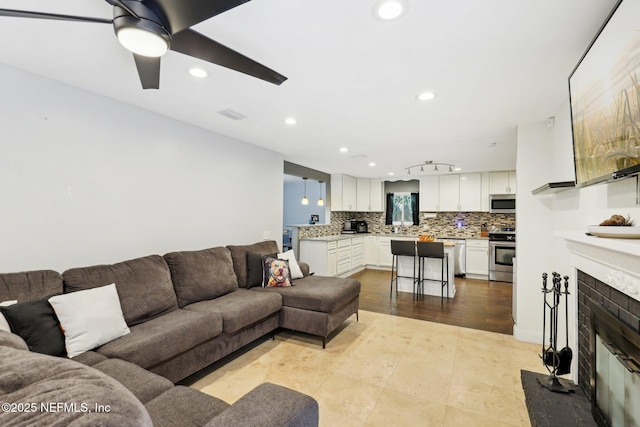 living room featuring ceiling fan