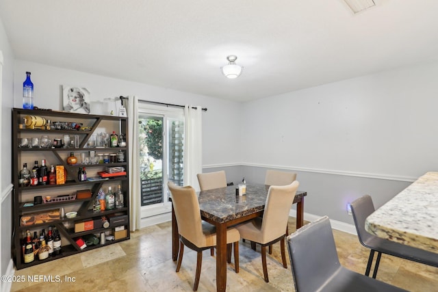 dining room featuring bar