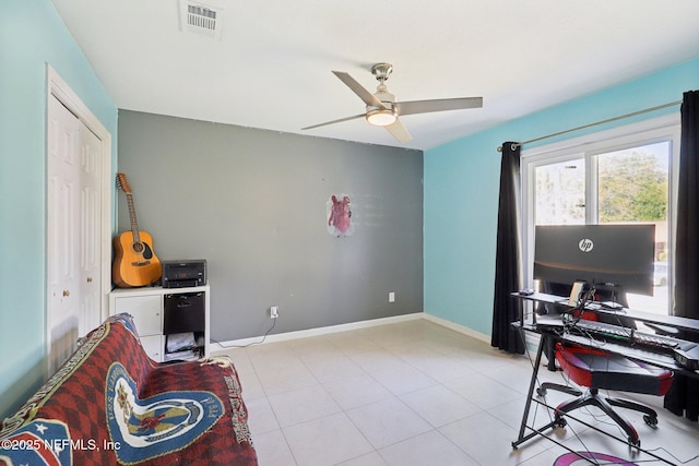 tiled office space with ceiling fan