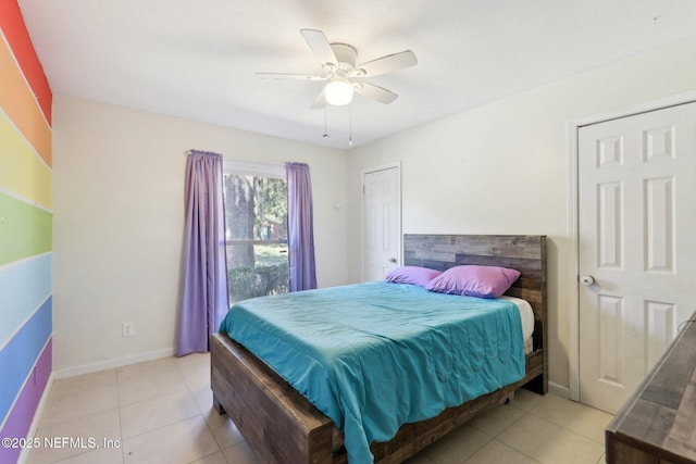 tiled bedroom with ceiling fan