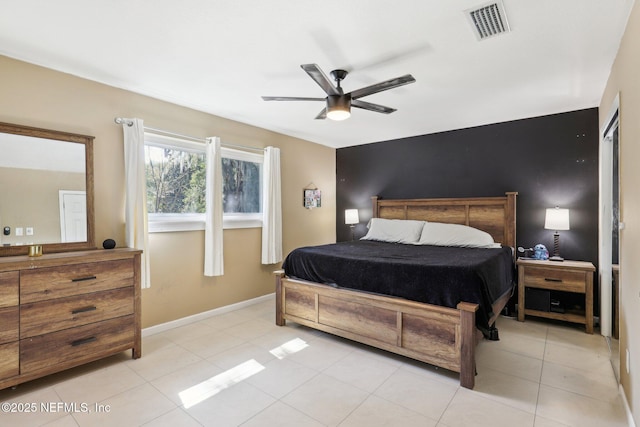 bedroom featuring light tile patterned flooring and ceiling fan