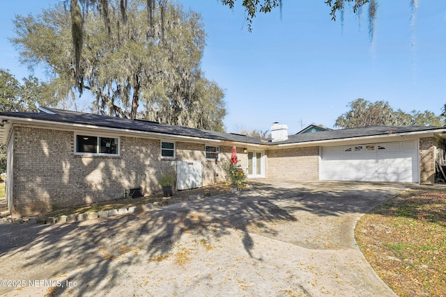 ranch-style house featuring a garage