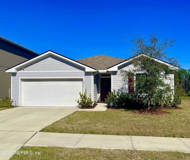 ranch-style house with a garage and a front lawn