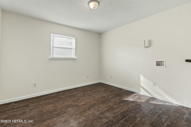 unfurnished room with a textured ceiling and dark hardwood / wood-style floors