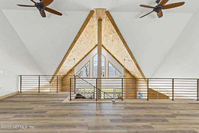 bonus room with high vaulted ceiling, beam ceiling, ceiling fan, and wood finished floors