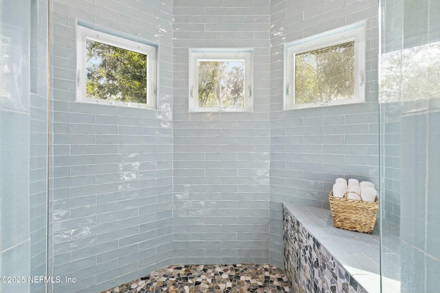 bathroom with a tile shower