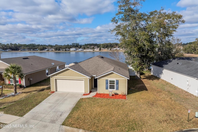 single story home with a garage, a water view, and a front yard