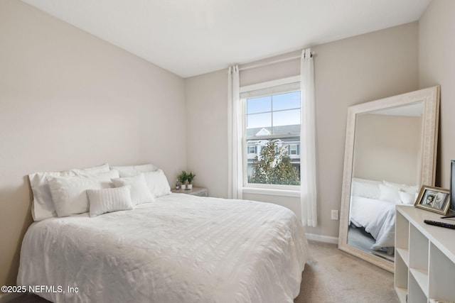 bedroom featuring light carpet