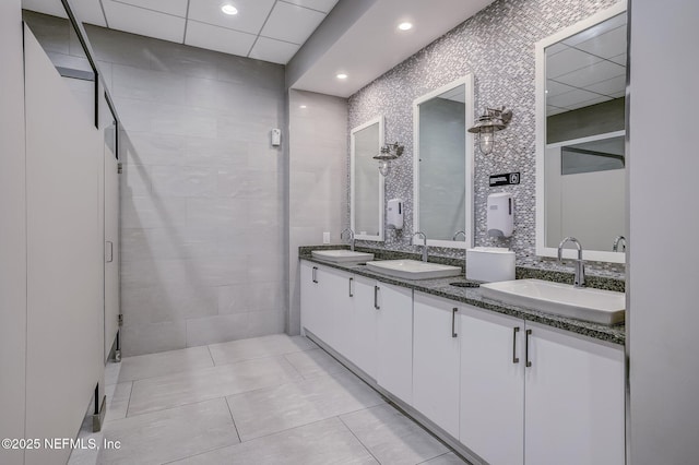 bathroom featuring tile patterned flooring and vanity