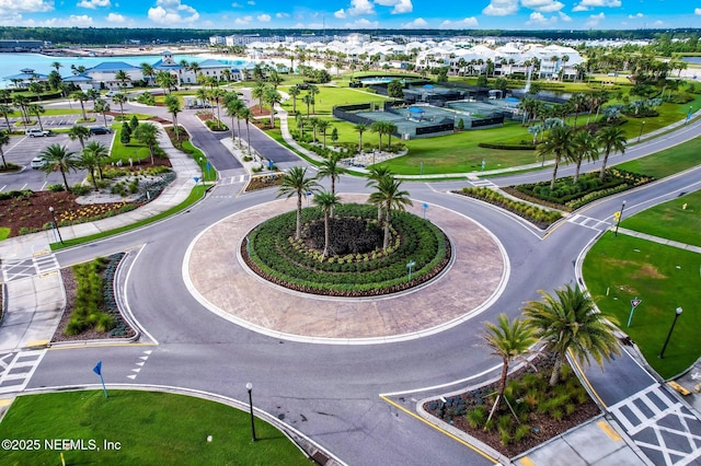 birds eye view of property with a water view