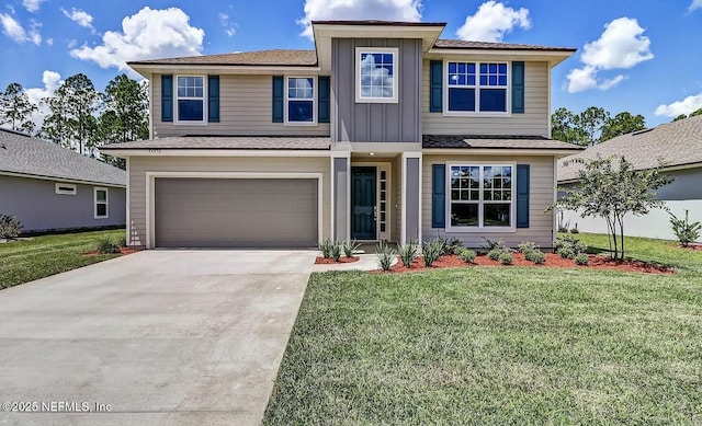 view of front of property featuring a garage and a front lawn