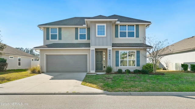 traditional-style home with driveway, a garage, board and batten siding, and a front yard