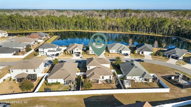 bird's eye view with a residential view, a water view, and a view of trees