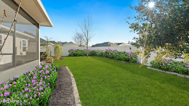 view of yard featuring a fenced backyard