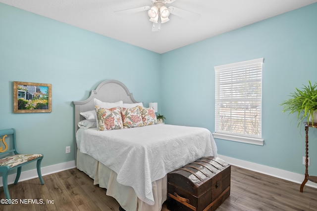 bedroom featuring ceiling fan and dark hardwood / wood-style floors