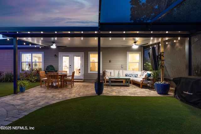 rear view of house with an outdoor living space, a patio, ceiling fan, and french doors