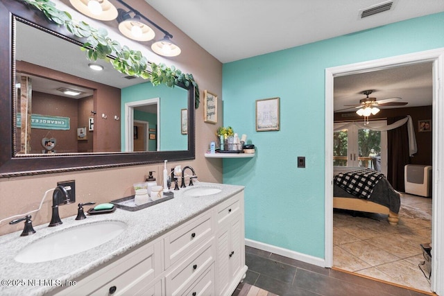 bathroom with vanity, tile patterned flooring, and ceiling fan