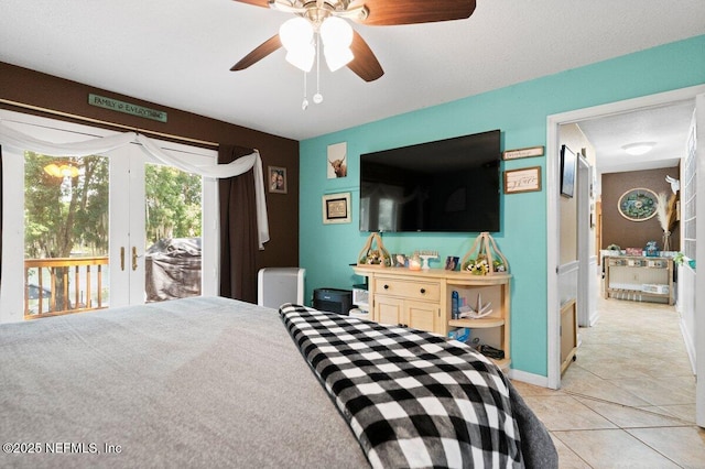 bedroom with ceiling fan, access to exterior, and light tile patterned floors