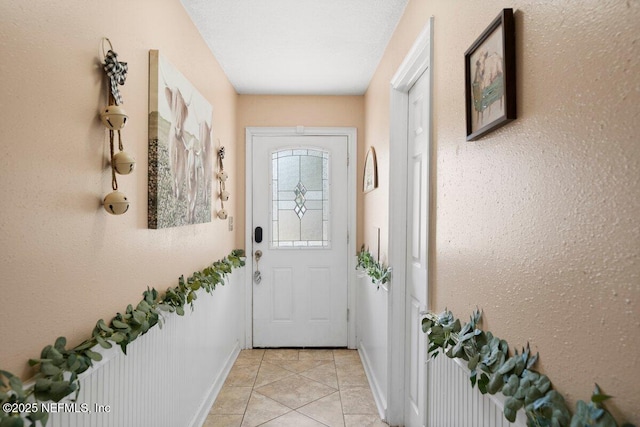 entryway with light tile patterned floors