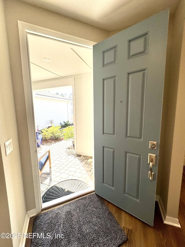 entrance foyer with dark hardwood / wood-style floors