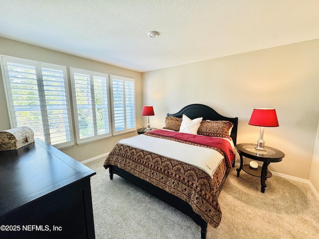 carpeted bedroom with a textured ceiling