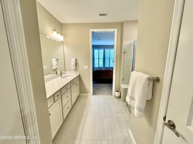 bathroom with vanity and walk in shower