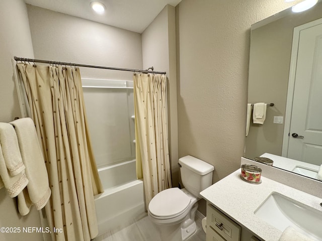 full bathroom with vanity, shower / bathtub combination with curtain, and toilet