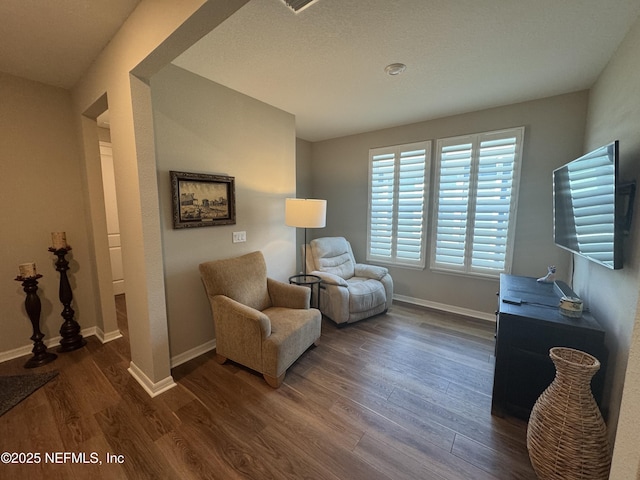 living area featuring dark hardwood / wood-style floors