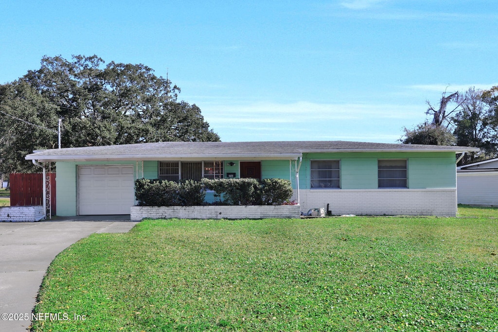 single story home with a garage and a front yard