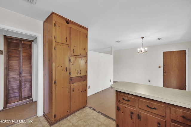 kitchen with pendant lighting and a chandelier