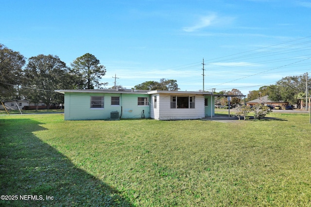 back of house with a yard