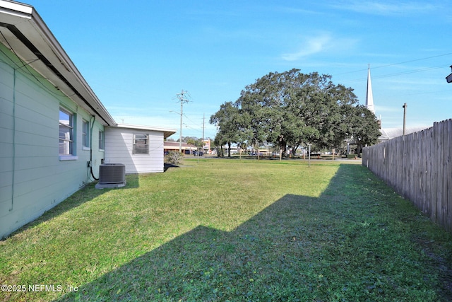 view of yard featuring central air condition unit