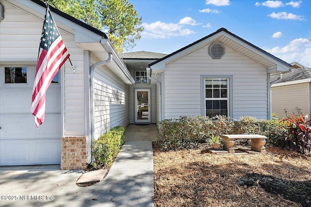 property entrance featuring a garage