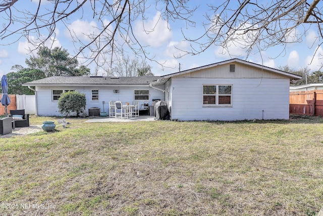 rear view of property with a yard, a patio area, fence, and central air condition unit