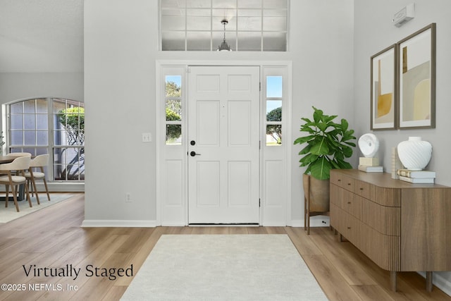 entryway with plenty of natural light and light hardwood / wood-style floors