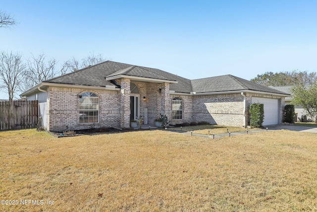 view of front of home featuring a garage and a front yard