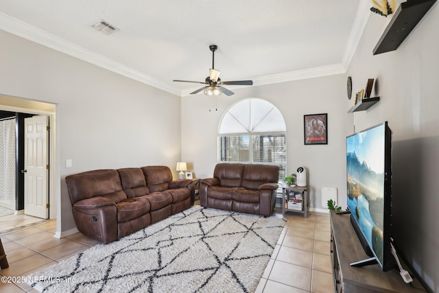 living room featuring ceiling fan, ornamental molding, and light tile patterned floors