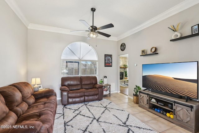 living room featuring crown molding, ceiling fan, and light tile patterned floors