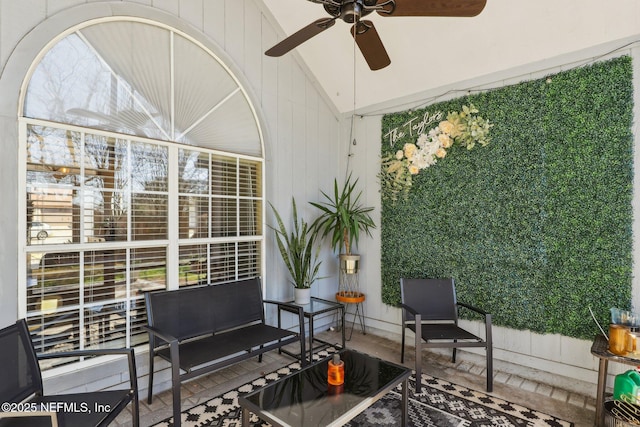 office area featuring vaulted ceiling, ceiling fan, and plenty of natural light