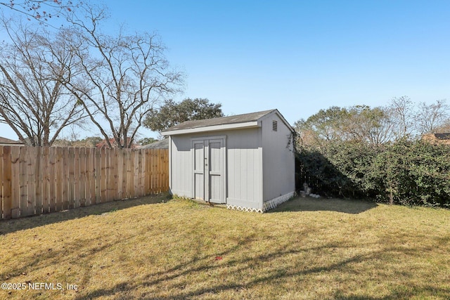 view of outbuilding with a lawn