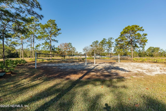 view of yard featuring a rural view and volleyball court