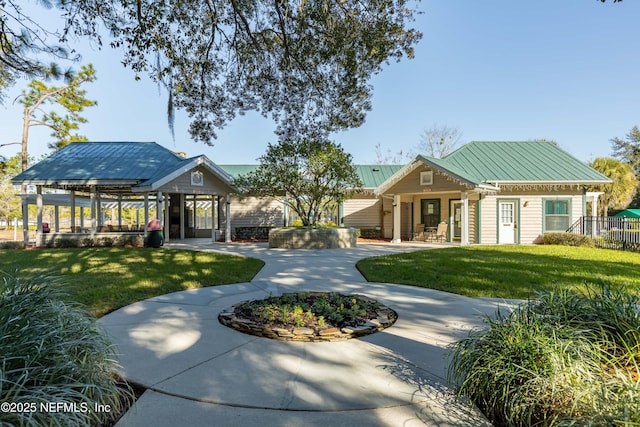 view of property's community featuring a gazebo and a lawn