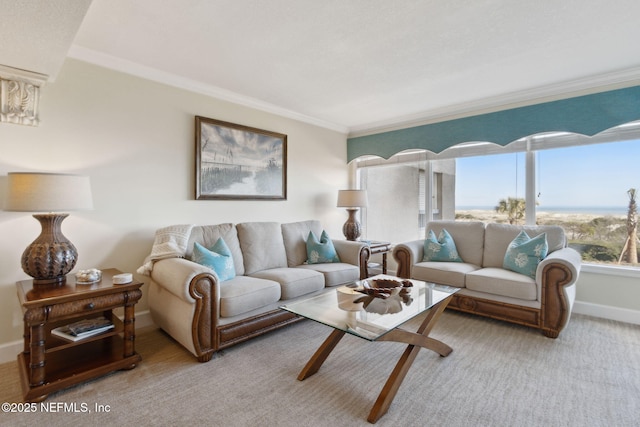 carpeted living room with ornamental molding