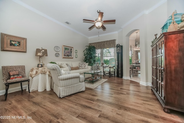 living room with crown molding, hardwood / wood-style flooring, and ceiling fan