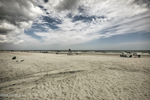 view of water feature with a beach view